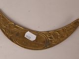 an image of a brass plate with a label on it