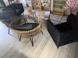 a black chair and a black chair in a living room