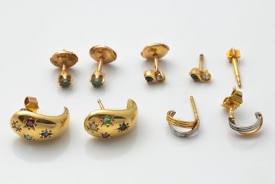 five pairs of gold earrings and a pair of earrings