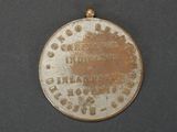 a medal that is on display on a table
