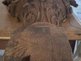 a table with a bunch of wood carvings on it