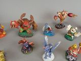 many figurines of different types and sizes on the table