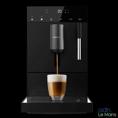 a coffee machine with a cup of coffee on top of it