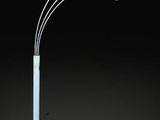 a white floor lamp with three lights and a white base