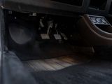 a close up of a car ' s dashboard with the door open