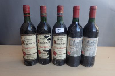 six bottles of wine are lined up on a table