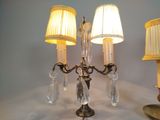 three lamps that are on a table with a lamp shade