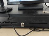 an image of a pos terminal with a keyboard and a monitor