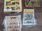 some comics are sitting on the floor next to each other