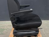 a close up of a chair on a pallet in front of a wall