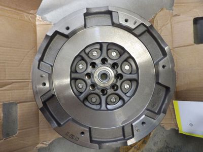 a close up of a clutch plate in a box