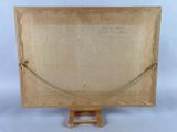 an old picture of a wooden easel with a piece of paper on top of it