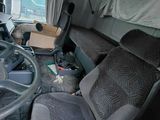 a truck with a steering wheel and a seat in the back