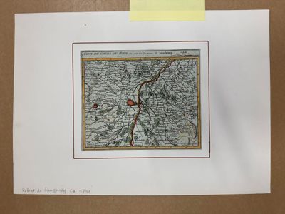 une vieille carte d'une ville sur laquelle figure un point rouge