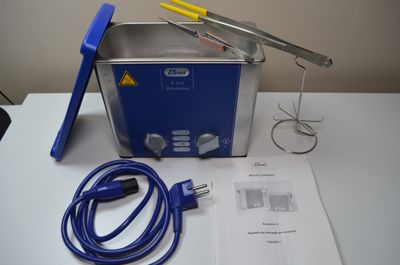 an image of a blue and silver waxing machine on a white table