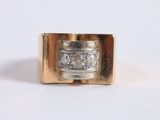 an image of a gold ring with diamonds on it
