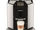 krups coffee machine with a cup of coffee in front of it