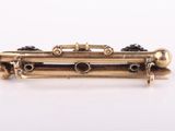 an image of a close up of a gold plated musical instrument