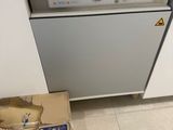 a box that is sitting on the floor in front of a dishwasher