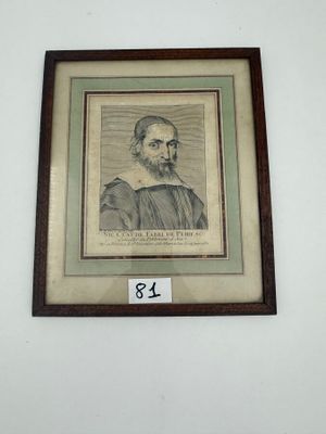 une vieille photo encadrée représentant un homme barbu