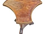 a small table with a curved top on a white background