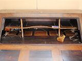 a wooden desk with a window in the middle of it