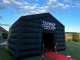 an inflatable tent with a red carpet and a red carpet in front of it