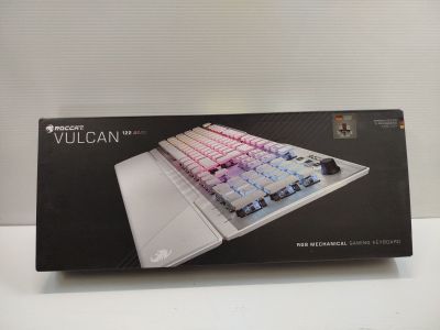 packaging of a white keyboard with a pink and blue key board