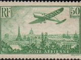 an old stamp with a picture of a plane flying over a city
