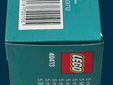 a box of legos sitting on a blue surface
