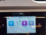 a close up of a printer with a screen on it