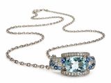 a blue topaz and white topaz necklace on a chain