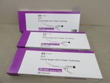 three boxes of dental instruments sitting on top of a table
