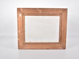 an old wooden picture frame sitting on top of a white surface