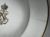 a plate with a crown on it on a table