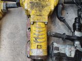 two electric tools that are laying on the floor