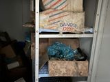 a shelf with boxes and bags on it in a room