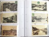 an open book with pictures of a river and buildings in it