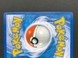 a close up of a pokemon card with a poke poke ball on it