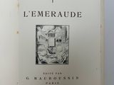 an open book with a picture of a building in the background