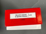 a small red box with a white label on it