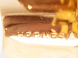 a close up of a gold plated object on a table