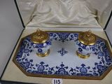 pair of blue and white porcelain salt and pepper shakers in a box