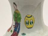 a vase with a picture of a man and a woman on it