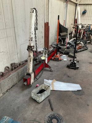 a picture of a garage with a lot of tools on the floor