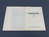 an open book with a black and white title on it