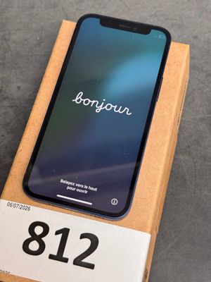 an iphone is sitting on top of a box on a table