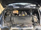 the engine of a car with its hood open and the hood open