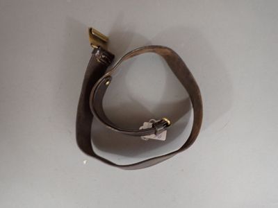 a brown leather strap with a metal hook on it