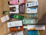 many different types of skin care products laid out on the floor